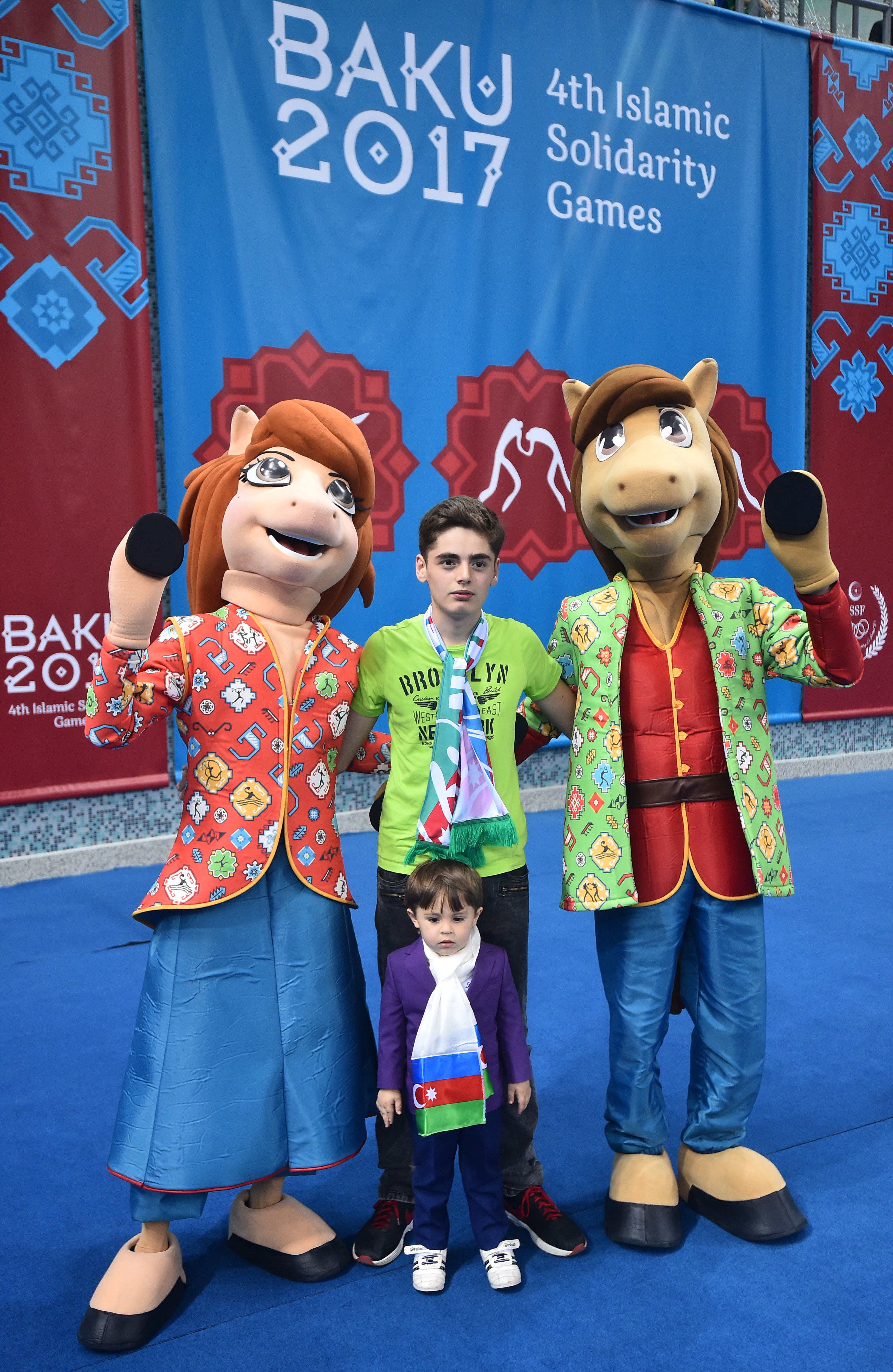 Baku 2017 4th Islamic Solidarity Games' mascots pose with spectators at the Sarhadchi Sports Olympic Center, in Baku, on May 14, 2017.